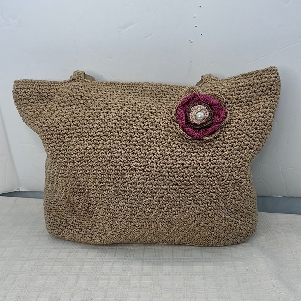The Sak  crochet Tan Tote Bag with Purple Flower Accent